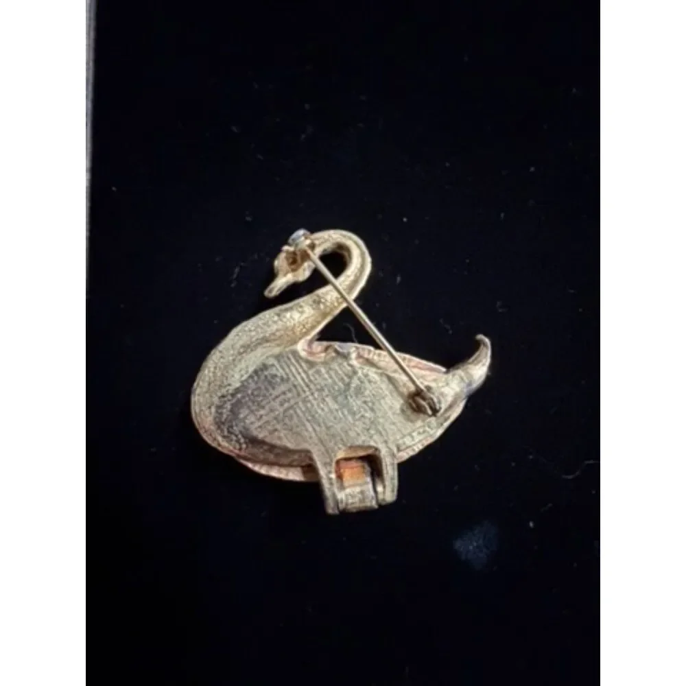 vtg.  Gold toned Swan Brooch/locket with Green Rhinestone eyes and opens up to